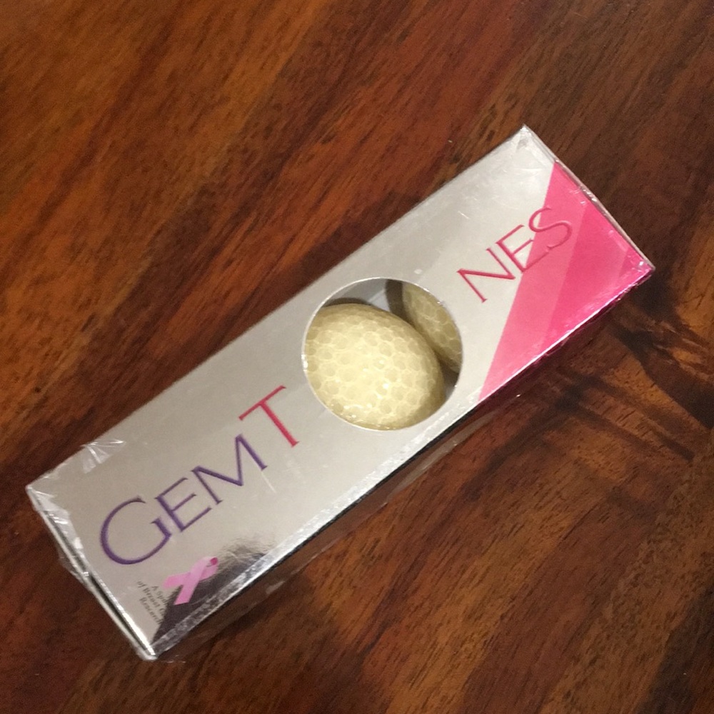 New/sealed Gemtones breast cancer golf balls